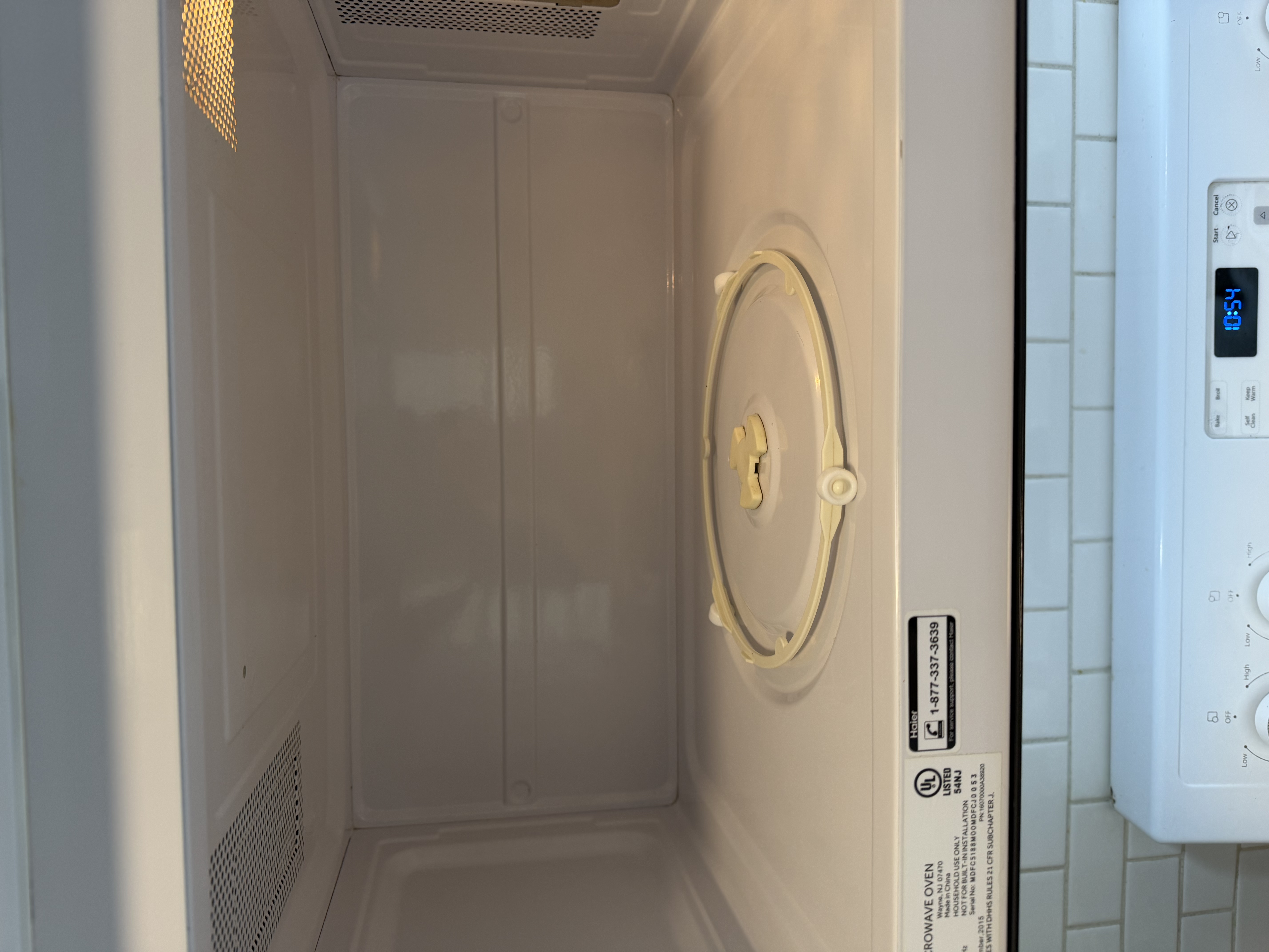 Microwave interior after cleaning — spotless white