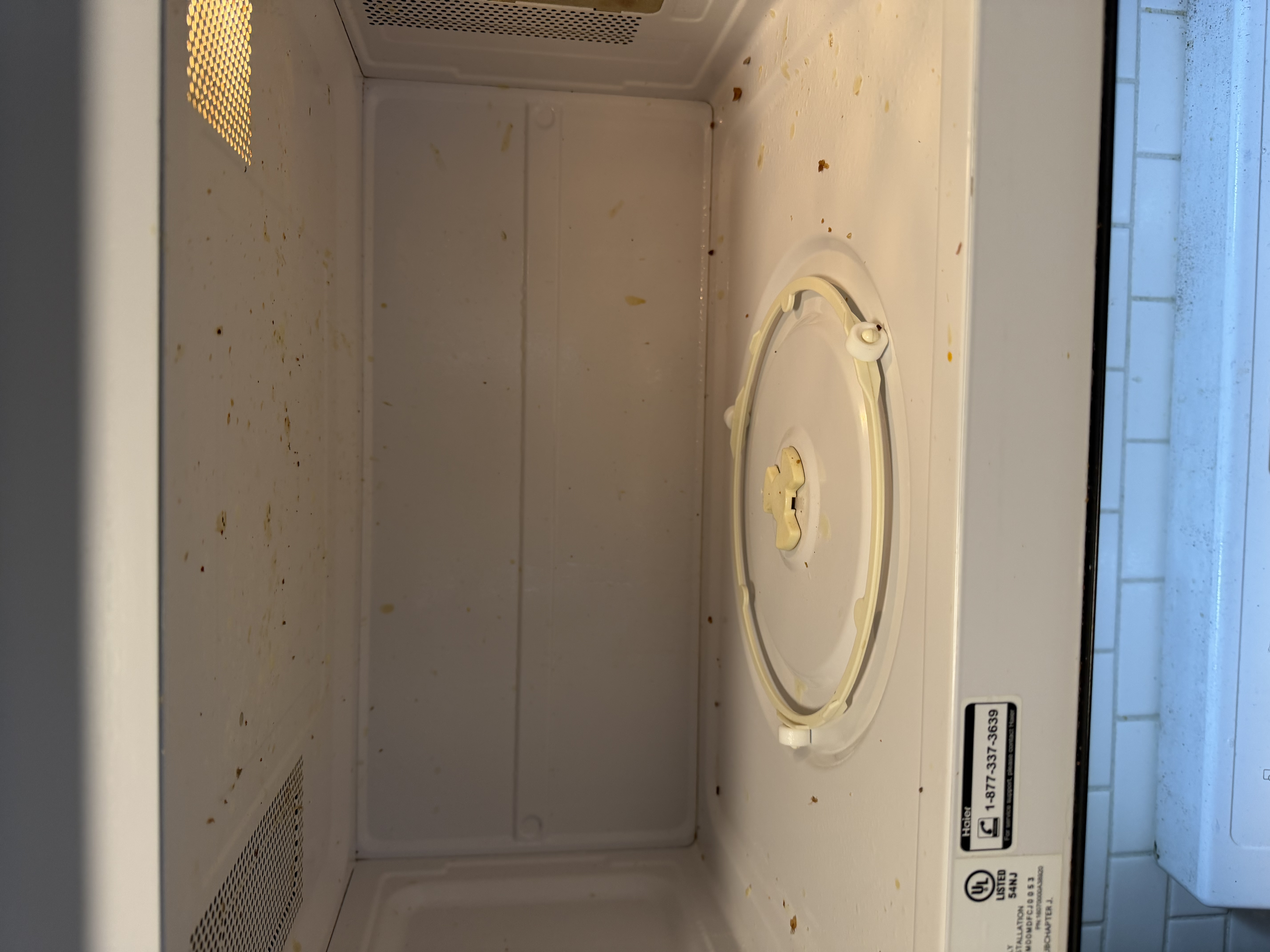 Microwave interior before cleaning — splattered and grimy