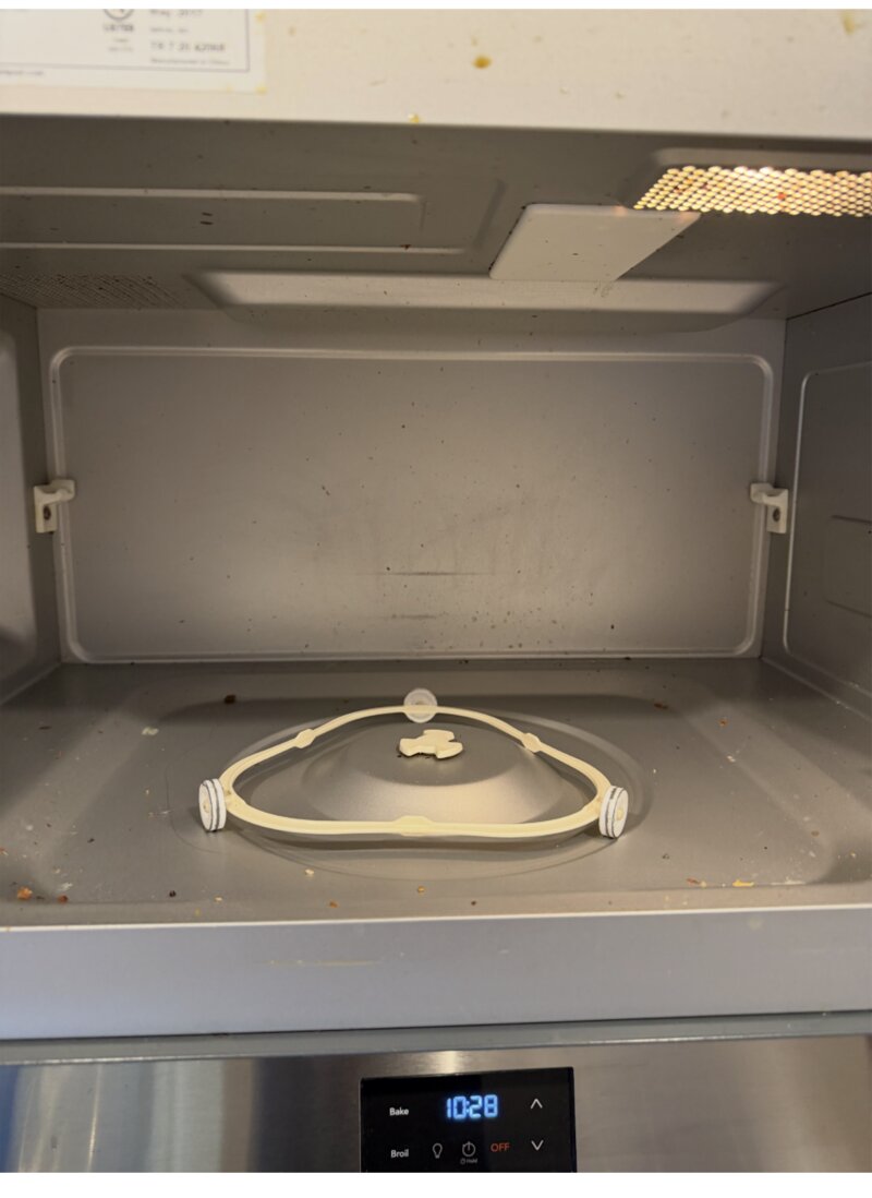 Microwave interior before cleaning — crumbs and splatter